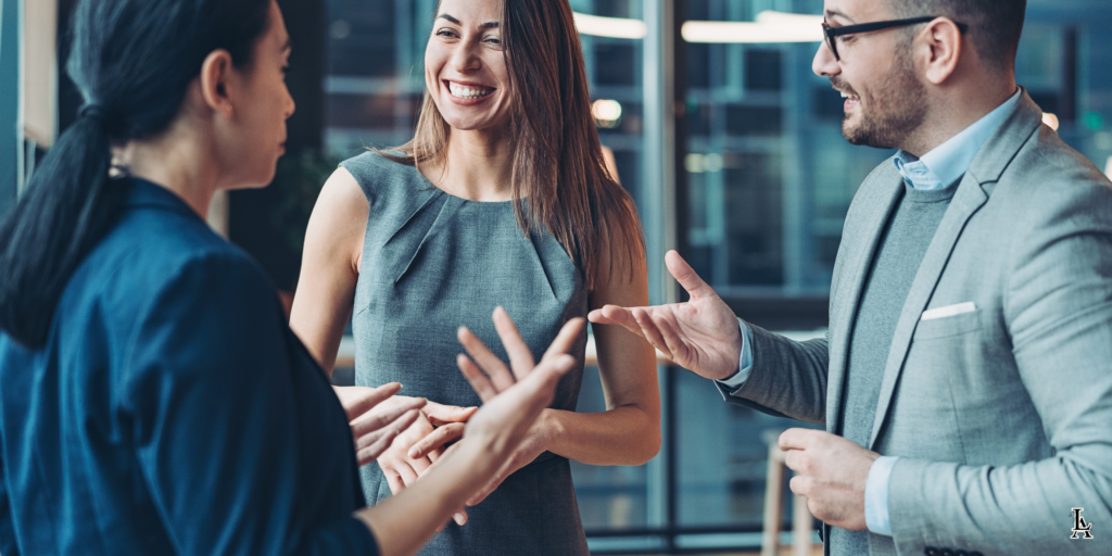 Business professionals engaged in a conversation during a networking event.