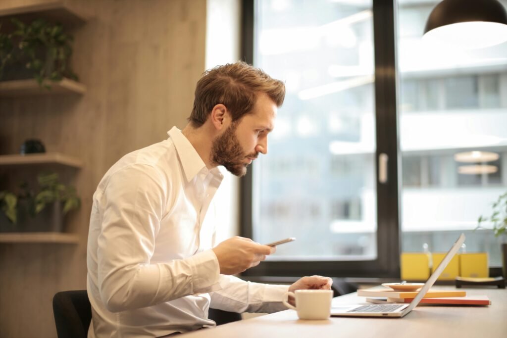 Business professional reviewing information on a laptop.